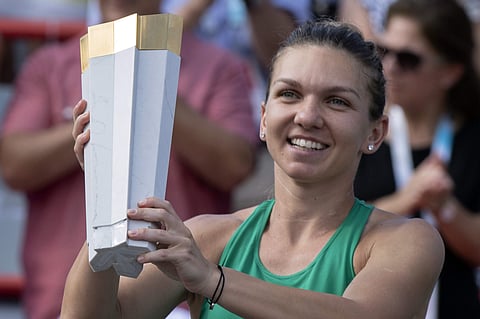 Simona Halep, of Romania, holds the trophy after defeating Sloane Stephens, of the United States, in the final of the Rogers Cup women's tennis tournament. (Photo | AP)