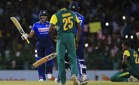 Sri Lanka's Dinesh Chandimal, left, and Isuru Udana celebrate their team's victory over South Africa by three wickets in their Twenty20 cricket match in Colombo, Sri Lanka, Tuesday. ( Photo | AP)