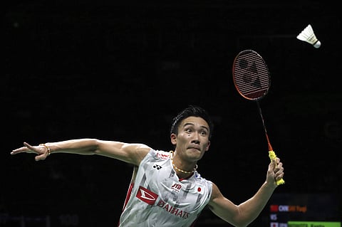 Kento Momota of Japan plays a shot while competing against Shi Yuqi of China in their men's badminton championship match at the BWF World Championships in Nanjing, China. (File Photo | AP)