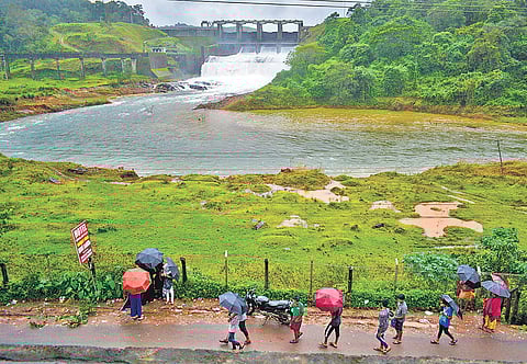 Water gushes out of the Banasurasagar dam in Wayanad; (below) Perunnamma, 105, waits at a relief camp in Pulinjal GHS | Manu R Mavelil