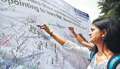 Students of Mount Carmel College participating in a signature campaign on Monday against the purported plan to shift Aero India 2019 | Pushkar V