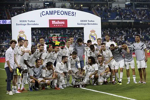 Real Madrid players pose with the trophy after winning the Santiago Bernabeu trophy football match between Real Madrid and AC Milan | AP