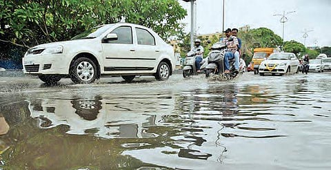 Vehicles moving in water logged road after the Friday night rains at Banjara hills, in Hyderabad. (Photo | R Satish Babu)