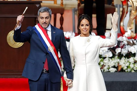 Paraguay's new President Mario Abdo Benitez, flanked by his wife Silvana Lopez, acknowledges the crowd after taking the oath of office at 'Lopez Palace' in Asuncion, Paraguay. ( Photo | AP)