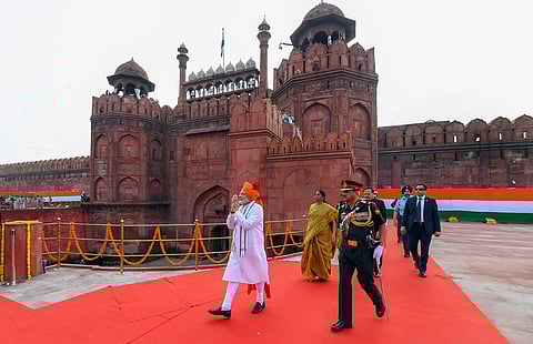 Prime Minister Narendra Modi greets the people as he proceeds towards the dais to address the nation from the ramparts of Red Fort during the 72nd Independence Day function in New Delhi on Wednesday August 15 2018. | PTI