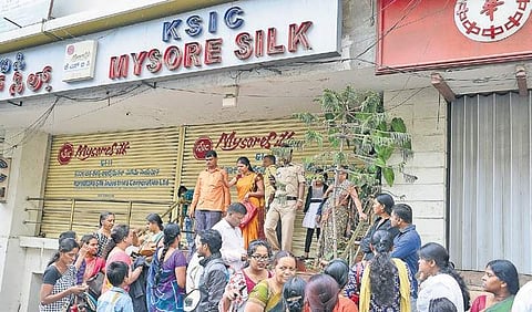 Customers protest outside a KSIC outlet in the city after they found out that the sale had been called off | Pushkar V