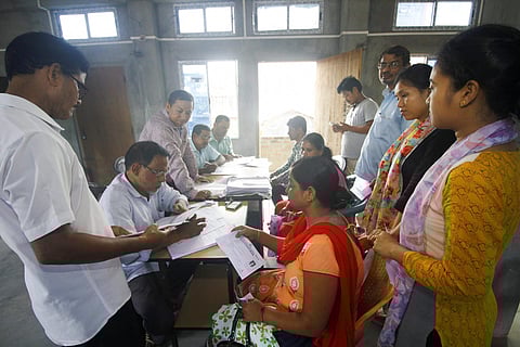 People whose names were missing in the final draft of National Register of Citizenship NRC published on 30th July 2018 filling new enrollment forms at an NRC Seva Kendra in Guwahati on Aug 11 2018. (Photo | PTI)