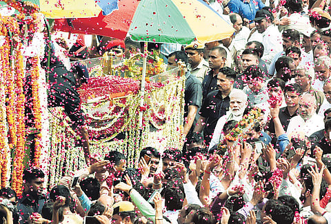 Prime Minister Narendra Modi, BJP president Amit Shah and others walk along with a gun carriage carrying the mortal remains of former PM Atal Bihari Vajpayee, in New Delhi on Friday | Parveen Negi