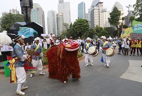 Supporters of the combined Koreas team attend prior the opening ceremony for the 18th Asian Games in Jakarta, Indonesia. (Photo | AP)