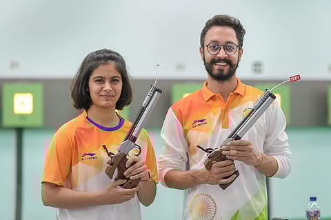Indian 10m Air Pistol team members Manu Bhaker and Abhishek Verma pose after a practice session at the 18th Asian Games in Palembang on Saturday Aug 18 2018. (Photo | AP)