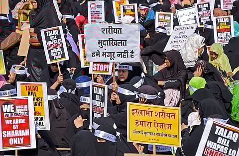 Muslim community women display placards during a protest against 'triple talaq' bill at the Azad maidan in Mumbai. | (File | PTI)