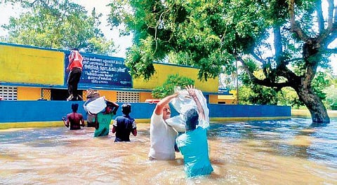 Rescue operations in progress in Chidambaram on Saturday. More than 20 people were rescued from villages along Cauvery river | Express