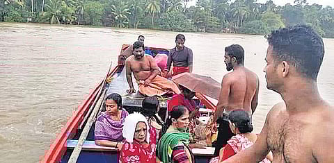 Fishermen from Pookottu Araya Samajam Karayogam in Alappad rescuing stranded people in flood-hit Chengannur on Sunday