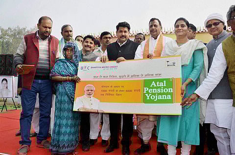 UP minister offers Atal Pension Yojana to a beneficiary. (File | PTI)