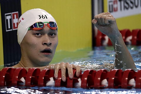 China's Sun Yang reacts after his heat of the men's 200m freestyle during swimming competition at the 18th Asian Games in Jakarta, Indonesia, Sunday, Aug. 19, 2018. | AP