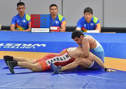 India's wrestler Sushil Kumar with Bahrain's Adam Batirov in the men's freestyle wrestling 74kg qualification round at the Asian Games 2018 in Jakarta on Sunday August 19 2018. (Photo | AP)