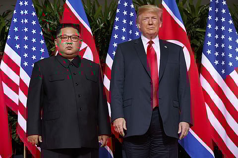 FILE - In this June. 12, 2018, file photo, U.S. President Donald Trump meets with North Korean leader Kim Jong Un on Sentosa Island, in Singapore. The White House says President Donald Trump received a new letter from North Korean leader Kim Jong Un Wedne