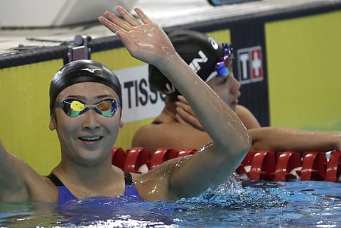 Japan's Rikako Ikee, reacts after her women's 100m freestyle heat during swimming competition at the 18th Asian Games in Jakarta, Indonesia, Monday, Aug. 20, 2018. | AP