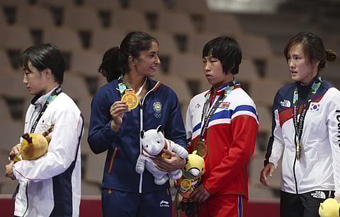 Vinesh Phogat with Yuki Irie of Japan, Kim Son Hyang of North Korea and Kim Hyungjoo of South Korea with at the podium | AP