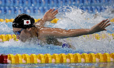 Japan's Rikako Ikee swims in her heat of the women's 100m butterfly during swimming competition at the 18th Asian Games in Jakarta, Indonesia, Tuesday, Aug. 21, 2018. | AP