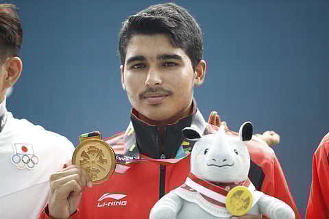 Indian shooter Saurabh Chaudhary, 16, won the gold medal for 10m air pistol at the Asian Games being held in Indonesia. He hails from Meerut district of Uttar Pradesh. He belongs to a farming family of Kalina village. (Photo | AP)