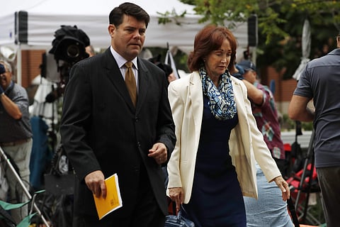 Paul Manafort's wife Kathleen Manafort, right, walks with Manafort spokesman Jason Maloni, to federal court for jury deliberations in the trial of the former Trump campaign chairman, in Alexandria. (Photo | AP)