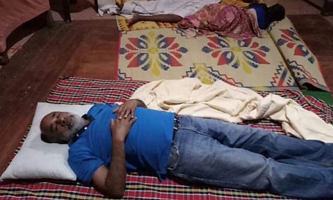 Union minister Alphons Kannanthanam sleeping at Changanassery SB high school camp. (Photo | Facebook)