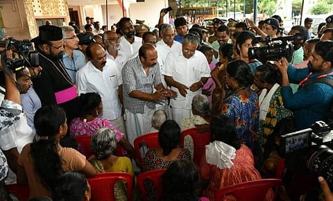 CM Vijayan interacting with inmates of a relief camp set up at Gregorios School, North Paravoor in Ernakulam district. (Photo | Twitter)