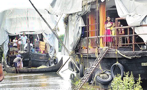 The families at Cheepungal near Kumarakom, who shifted to houseboats after their houses were inundated | Vishnu Prathap