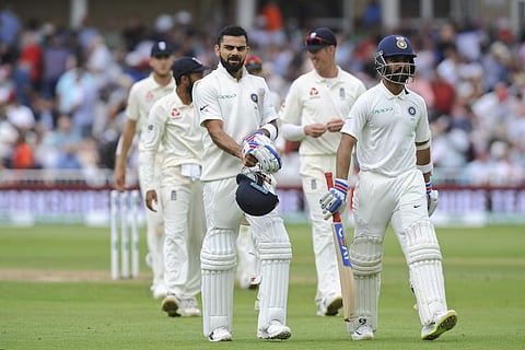 Indian cricket captain Virat Kohli, left, and India's Ajinkya Rahane walk off the field as the play breaks for tea during the third day of the third Test match between England and India at Trent Bridge in Nottingham, England, Monday, Aug. 20, 2018. | AP