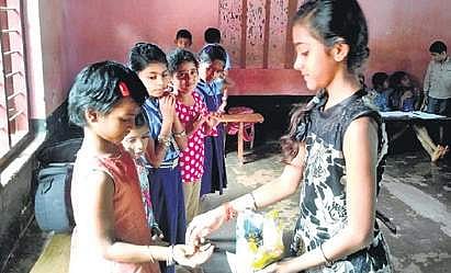 Harshitha from a Madikeri village celebrates her birthday at a relief centre in Sullia taluk.