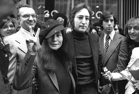 John Lennon and his wife, Yoko Ono, leave a U.S. Immigration hearing in New York City. ( Photo | AP)