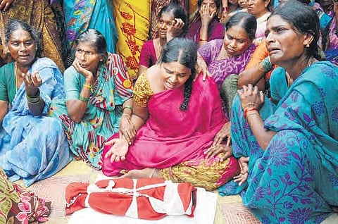 A bereaved mother breaks down in front of her child’s body atKorutlapeta in Rajanna-Sircilla district on Thursday | Express photo