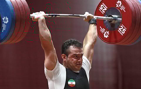 Iran's Sohrab Moradi competes during the men's 94kg weightlifting at the Asian Games in Jakarta. (Photo | AP)