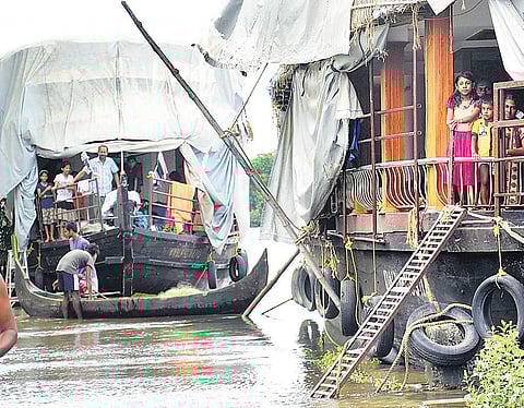 The families at Cheepungal near Kumarakom, who shifted to houseboats after their houses were inundated | Vishnu Prathap