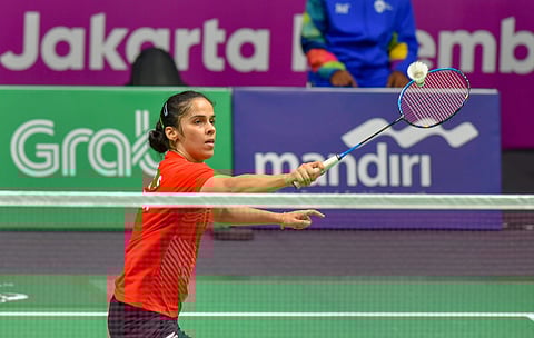 Indian shuttler Saina Nehwal in action against Japan player Nozomi Okuhara unseen at Women's Team quarterfinals event during the 18th Asian Games Jakarta Palembang 2018 in Indonesia on Monday August 20 2018. | (File | PTI)