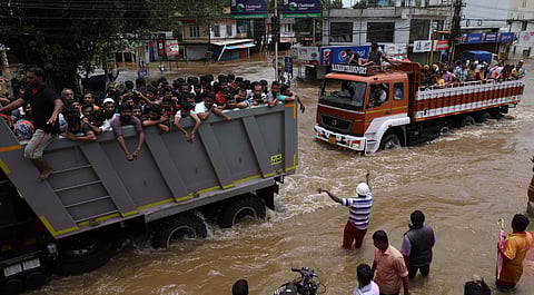Stranded people being evacuated and shifted to relief camps in Taurus, Tata Tippers at Thottumugham near Aluva (File | EPS/Melton Antony)
