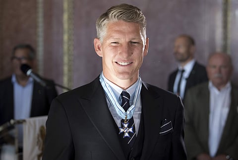 Bayern Munich's Bastian Schweinsteiger smiles after he received the Bavarian order of merits in Munich. (Photo | AP)