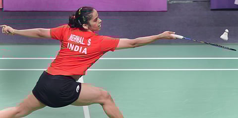 Indian shuttler Saina Nehwal reacts after winning a point against Tai Tzu Ying of Chinese Taipei during their women's singles semifinal match at the 18th Asian Games. (Photo | PTI)