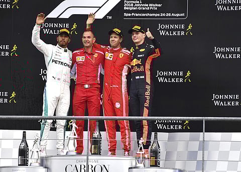 Ferrari driver Sebastian Vettel of Germany, second right, stands on the podium after winning the Belgian Formula One Grand Prix in Spa-Francorchamps, Belgium, Sunday, Aug. 26, 2018. | AP