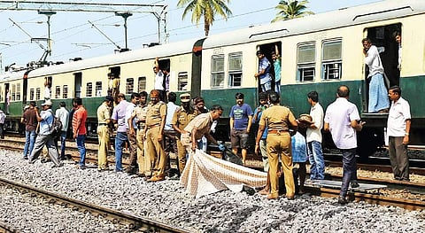 Policemen move the bodies of the victims near St Thomas Mount station. (File | EPS)