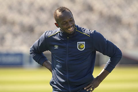 Jamaica's Usain Bolt reacts during training with the Central Coast Mariners soccer team in Newcastle. | AP