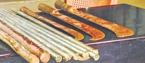 The swords and the iron and wooden rods which the police recovered | express