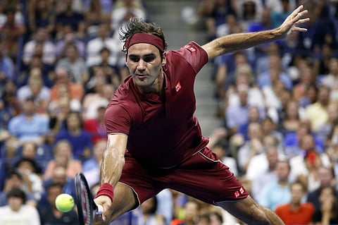 Roger Federer returns a shot to Yoshihito Nishioka during the first round of the US Open tennis tournament | AP