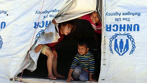 Syrian refugee children look from their tent near Mafraq, Jordan. (Photo | AP)