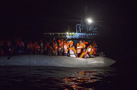 Representational image: Migrants wait to be rescued off the coast of Libya in the early hours of Thursday night, Aug. 2, 2018, as rescuers throw life jackets at them and urge them to stay calm. (Photo | AP)