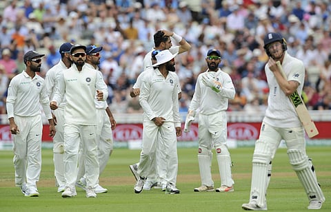 Indian cricket captain Virat Kohli, second left, celebrates with teammates the dismissal of England's Ben Stokes, right, during the third day of the first test cricket match between England and India at Edgbaston in Birmingham, England, Friday, Aug. 3, 20
