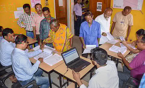 People check their names on the final draft of Assam's National Register of Citizens after it was released at a NRC Seva Kendra Hatigaon in Guwahati (FIle| PTI)