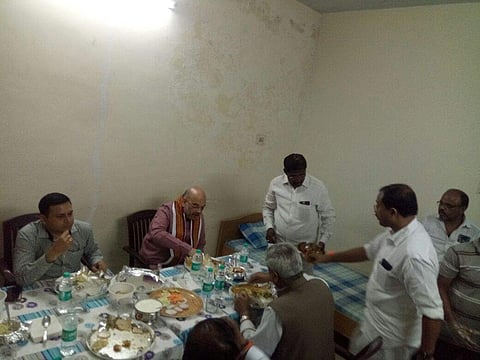 BJP national president Amit Shah having dinner at Pullur toll plaza on NH 44, border area of Kurnool district. (Photo | EPS)