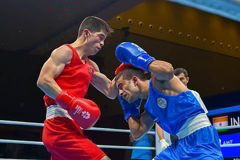 Amit Panghal (Blue) and PR Korea's Ryong Jong compete in the Men's Light Fly 46-49 kg Quarterfinal boxing event in the 18th Asian Games 2018 in Jakarta. (Photo | PTI)